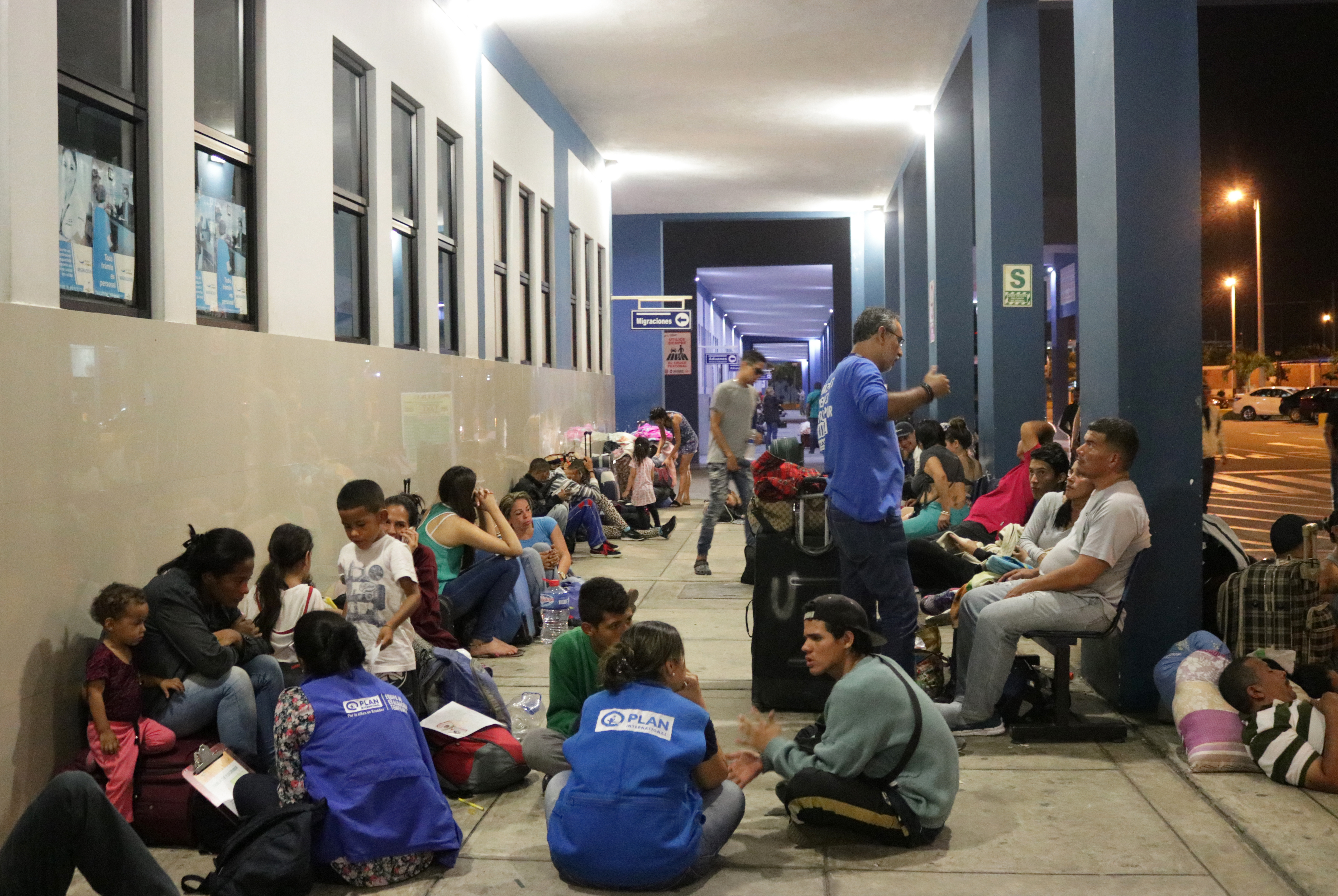 Plan International staff at migration centre